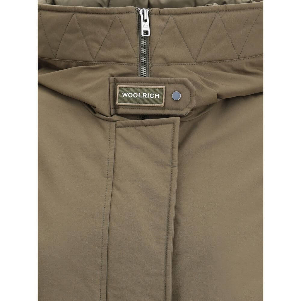 Green Cotton ParkaCotton Authentic 3-in-1 Parka Jacket by Woolrich, double layer decomposable design. Inside jacket with high collar and hood, closure by double-slider zipper, elastic cuffs, two zippered side welt pockets, all-over quilted and padded desi