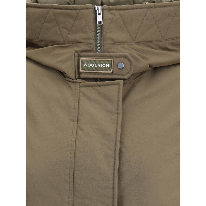 Green Cotton ParkaCotton Authentic 3-in-1 Parka Jacket by Woolrich, double layer decomposable design. Inside jacket with high collar and hood, closure by double-slider zipper, elastic cuffs, two zippered side welt pockets, all-over quilted and padded desi