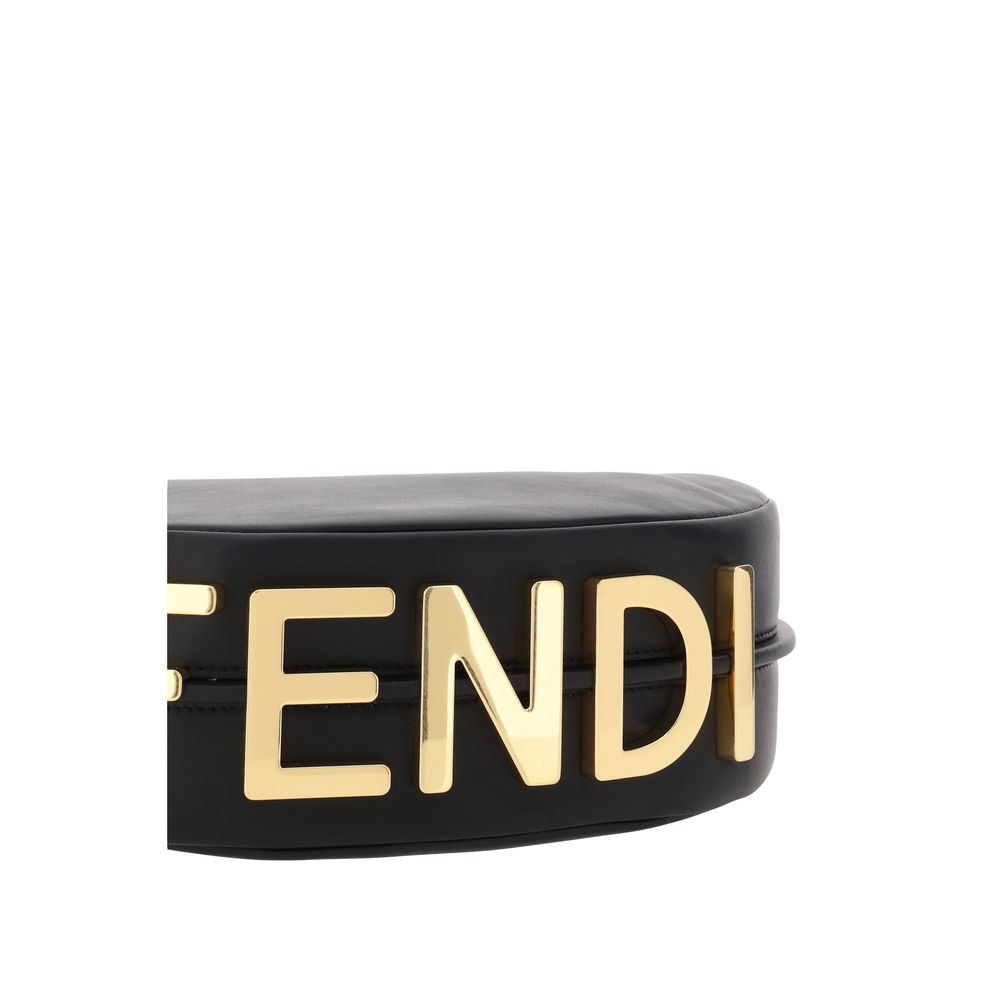 Black Calf Leather Bos Taurus Shoulder BagFendi’s leather Fendigraphy Shoulder Bag features a smooth leather design and a top zipper closure. It features a single adjustable handle and the brand’s iconic antiqued brass signature embossed on the base for a