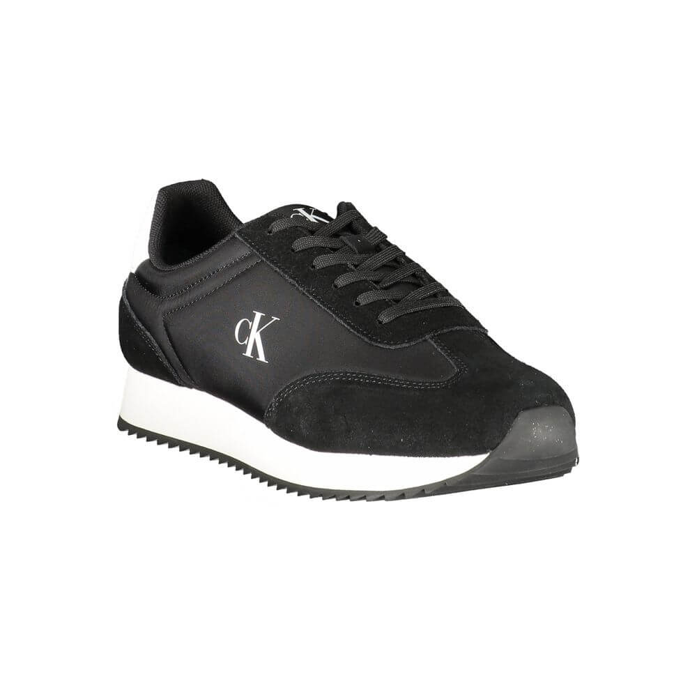 Black Leather Men SneakerStep out in sleek style with the Calvin Klein sports shoe, a nod to refined athleticism with an edge. Designed to make a statement as you stride, these kicks feature a sharp black base complemented by bold, contrasting white accen