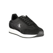 Black Leather Men SneakerStep out in sleek style with the Calvin Klein sports shoe, a nod to refined athleticism with an edge. Designed to make a statement as you stride, these kicks feature a sharp black base complemented by bold, contrasting white accen