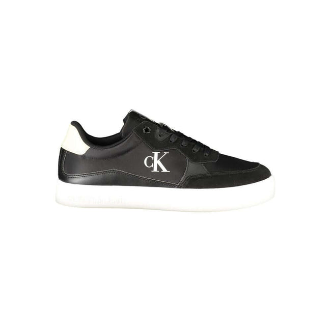Black Leather Men SneakerElevate your sneaker game with the sleek sophistication of Calvin Klein. These sports shoes radiate a bold charisma with their contrasting details and iconic logo print, ensuring you stride with confidence. Crafted for the modern