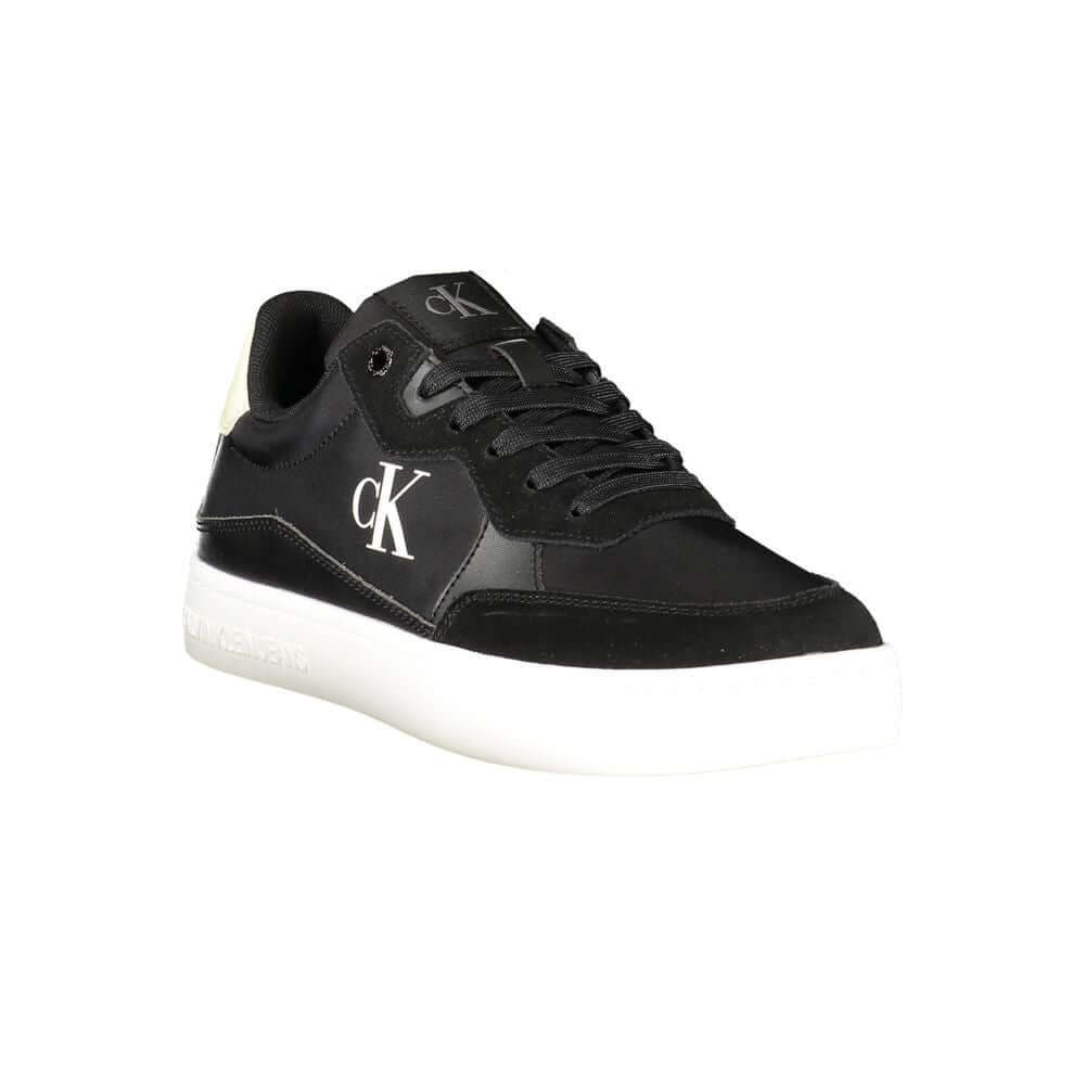 Black Leather Men SneakerElevate your sneaker game with the sleek sophistication of Calvin Klein. These sports shoes radiate a bold charisma with their contrasting details and iconic logo print, ensuring you stride with confidence. Crafted for the modern