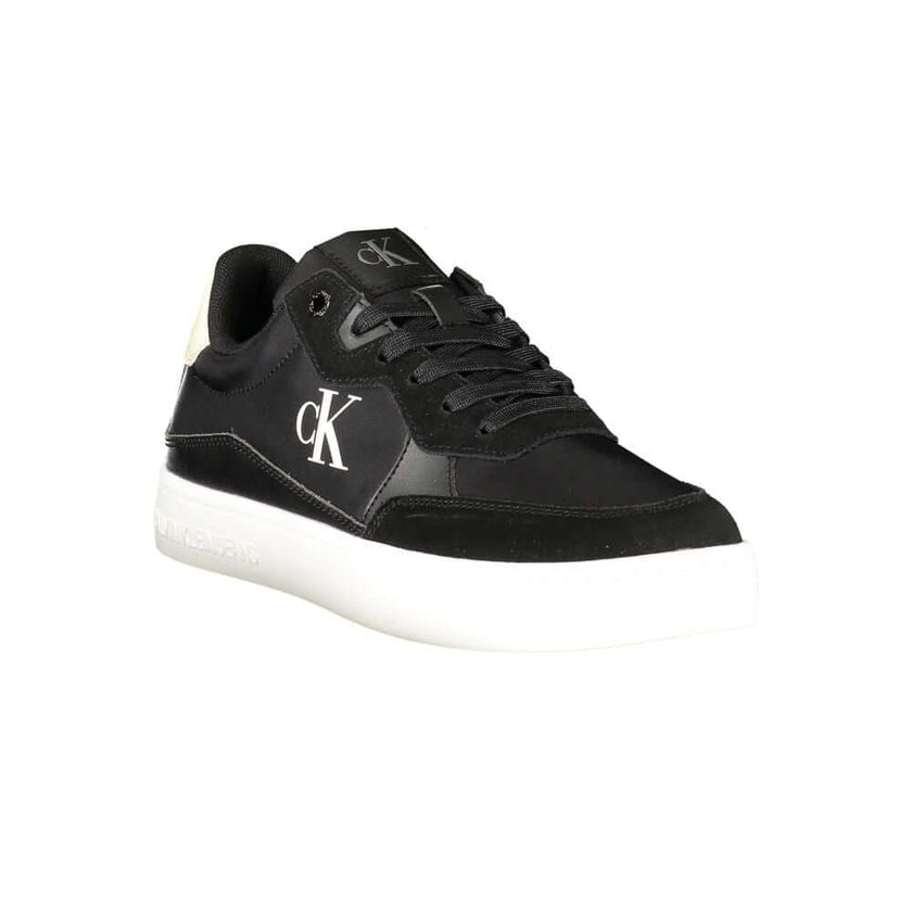 Black Leather Men SneakerElevate your sneaker game with the sleek sophistication of Calvin Klein. These sports shoes radiate a bold charisma with their contrasting details and iconic logo print, ensuring you stride with confidence. Crafted for the modern