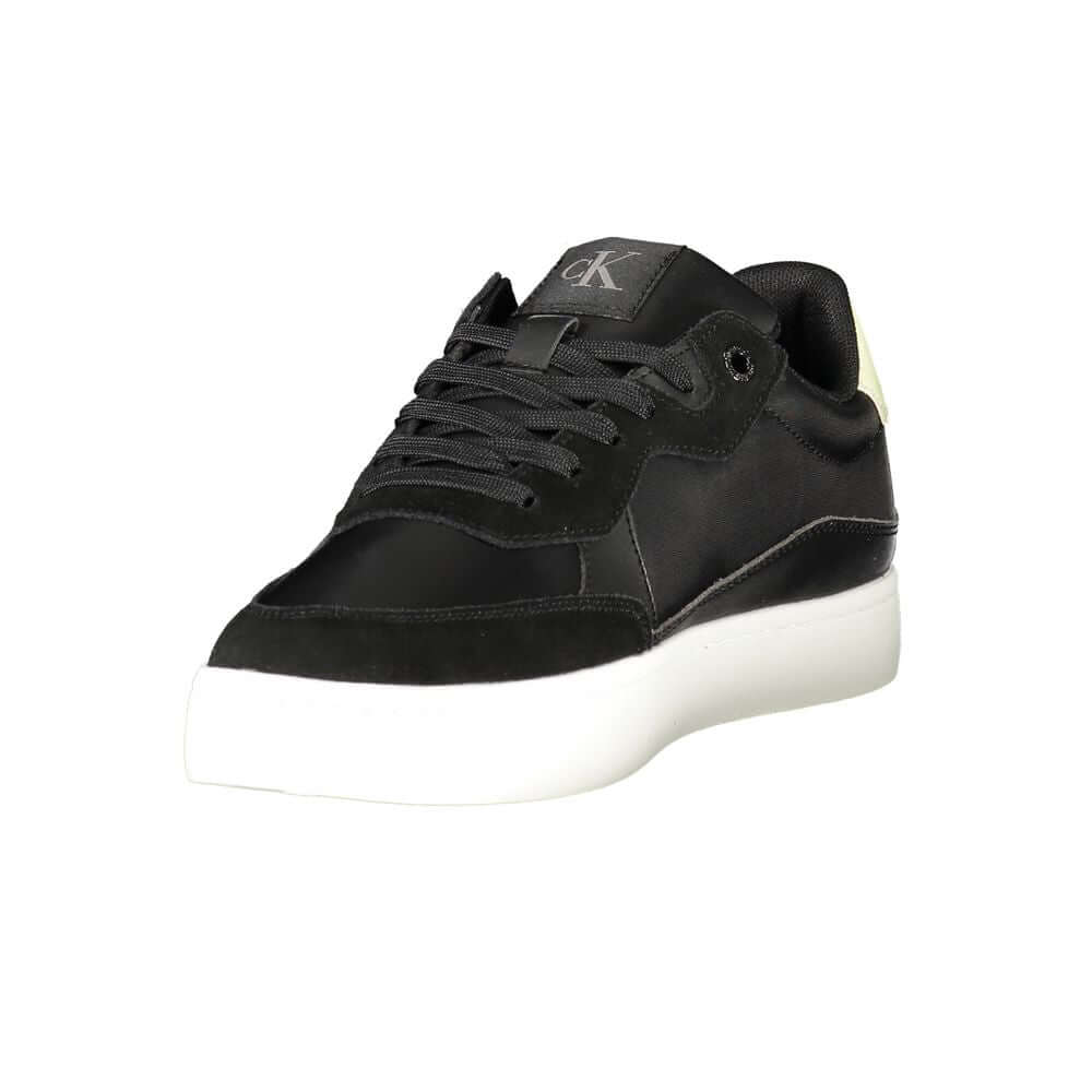 Black Leather Men SneakerElevate your sneaker game with the sleek sophistication of Calvin Klein. These sports shoes radiate a bold charisma with their contrasting details and iconic logo print, ensuring you stride with confidence. Crafted for the modern