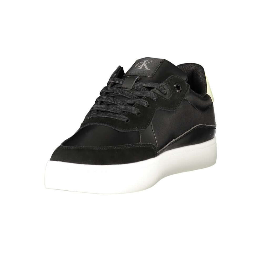 Black Leather Men SneakerElevate your sneaker game with the sleek sophistication of Calvin Klein. These sports shoes radiate a bold charisma with their contrasting details and iconic logo print, ensuring you stride with confidence. Crafted for the modern