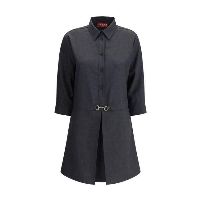 Gray Wool Casual DressGucci’s chemisier short Dress is an elegant and versatile garment made from high-quality wool. Featuring front buttons and three-quarter buttoned sleeves, it has a classic collar that echoes the traditional shirt style. The front ple