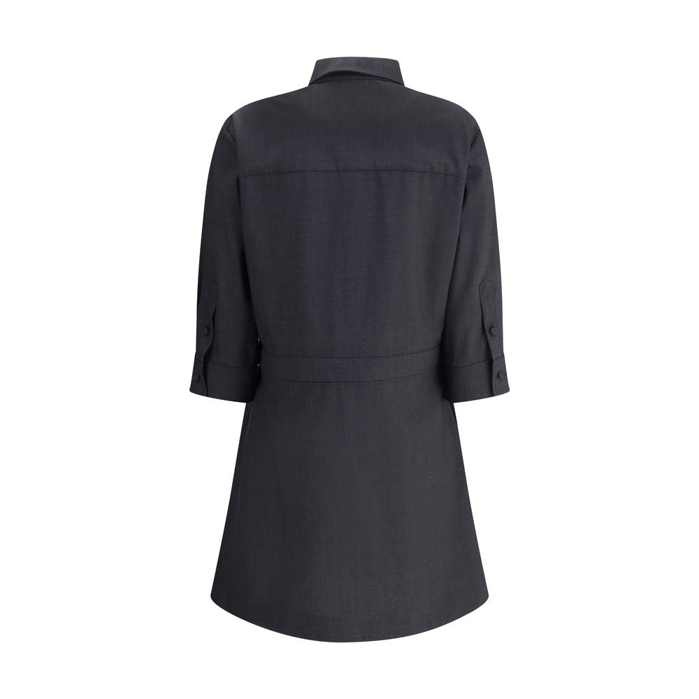 Gray Wool Casual DressGucci’s chemisier short Dress is an elegant and versatile garment made from high-quality wool. Featuring front buttons and three-quarter buttoned sleeves, it has a classic collar that echoes the traditional shirt style. The front ple