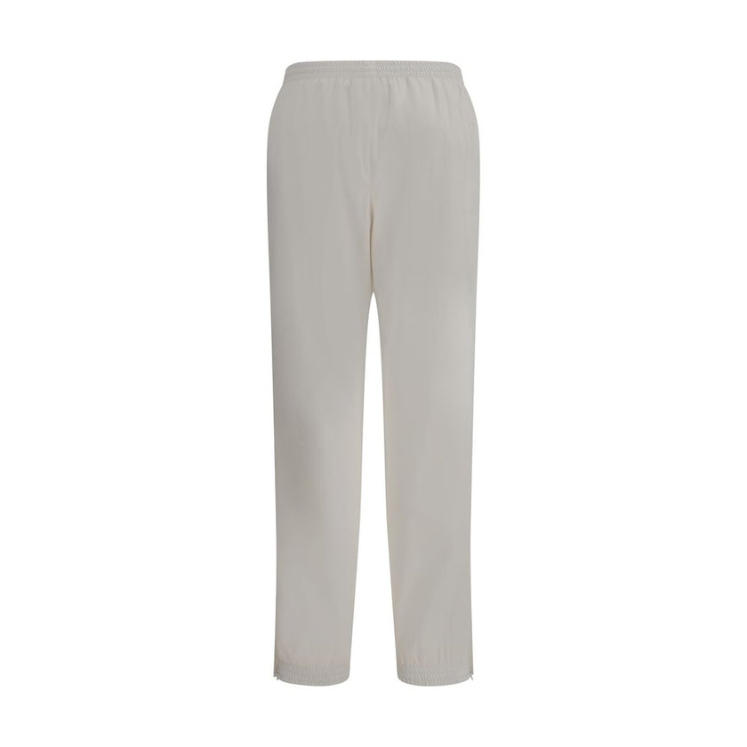 White Polyester Joggers (Workout Pants)Balenciaga’s Sweatpants combine comfort and contemporary style in an essential yet distinctive design. Featuring an elasticized waist and bottom, they feature two side welt pockets and a stitched logo on the front th