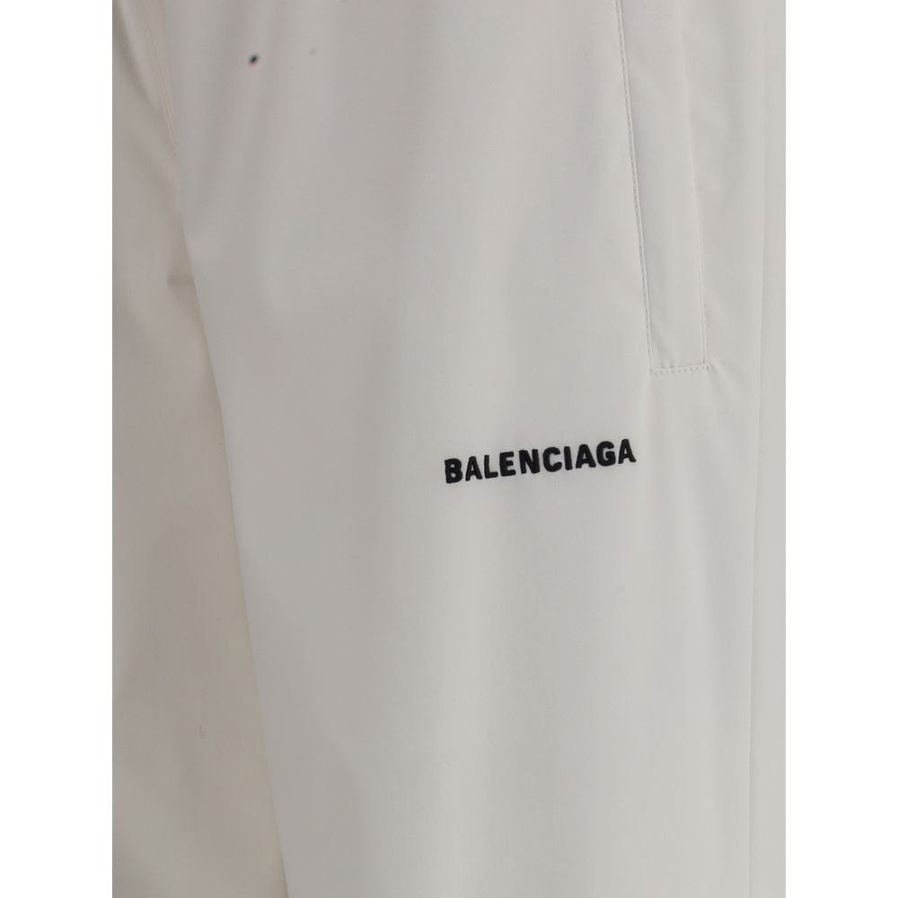 White Polyester Joggers (Workout Pants)Balenciaga’s Sweatpants combine comfort and contemporary style in an essential yet distinctive design. Featuring an elasticized waist and bottom, they feature two side welt pockets and a stitched logo on the front th