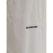 White Polyester Joggers (Workout Pants)Balenciaga’s Sweatpants combine comfort and contemporary style in an essential yet distinctive design. Featuring an elasticized waist and bottom, they feature two side welt pockets and a stitched logo on the front th