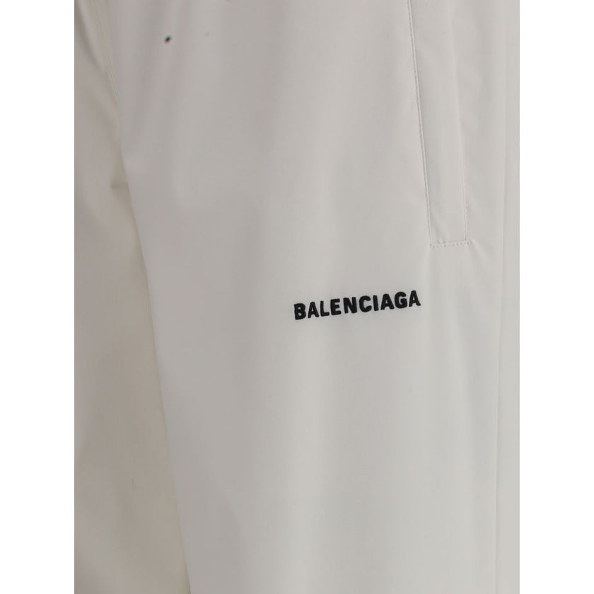 White Polyester Joggers (Workout Pants)Balenciaga’s Sweatpants combine comfort and contemporary style in an essential yet distinctive design. Featuring an elasticized waist and bottom, they feature two side welt pockets and a stitched logo on the front th