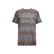 Zig zag T-ShirtMissoni’s sequined zig zag T-Shirt is a bright and refined garment made with Caperdoni’s exclusive loom work. The Maison’s classic zig zag pattern is enriched with lamé filaments and sequins, creating a bright and sophisticated effect. Made