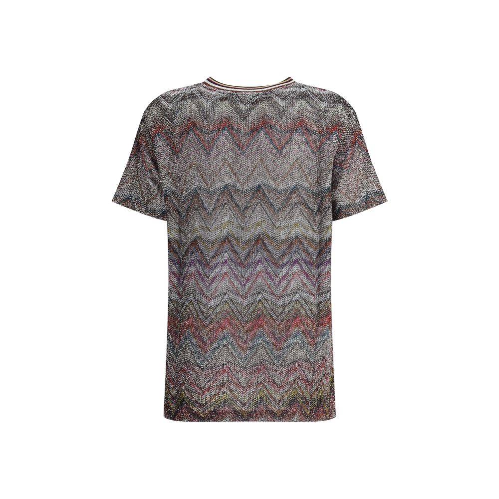Zig zag T-ShirtMissoni’s sequined zig zag T-Shirt is a bright and refined garment made with Caperdoni’s exclusive loom work. The Maison’s classic zig zag pattern is enriched with lamé filaments and sequins, creating a bright and sophisticated effect. Made