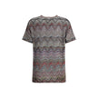 Zig zag T-ShirtMissoni’s sequined zig zag T-Shirt is a bright and refined garment made with Caperdoni’s exclusive loom work. The Maison’s classic zig zag pattern is enriched with lamé filaments and sequins, creating a bright and sophisticated effect. Made