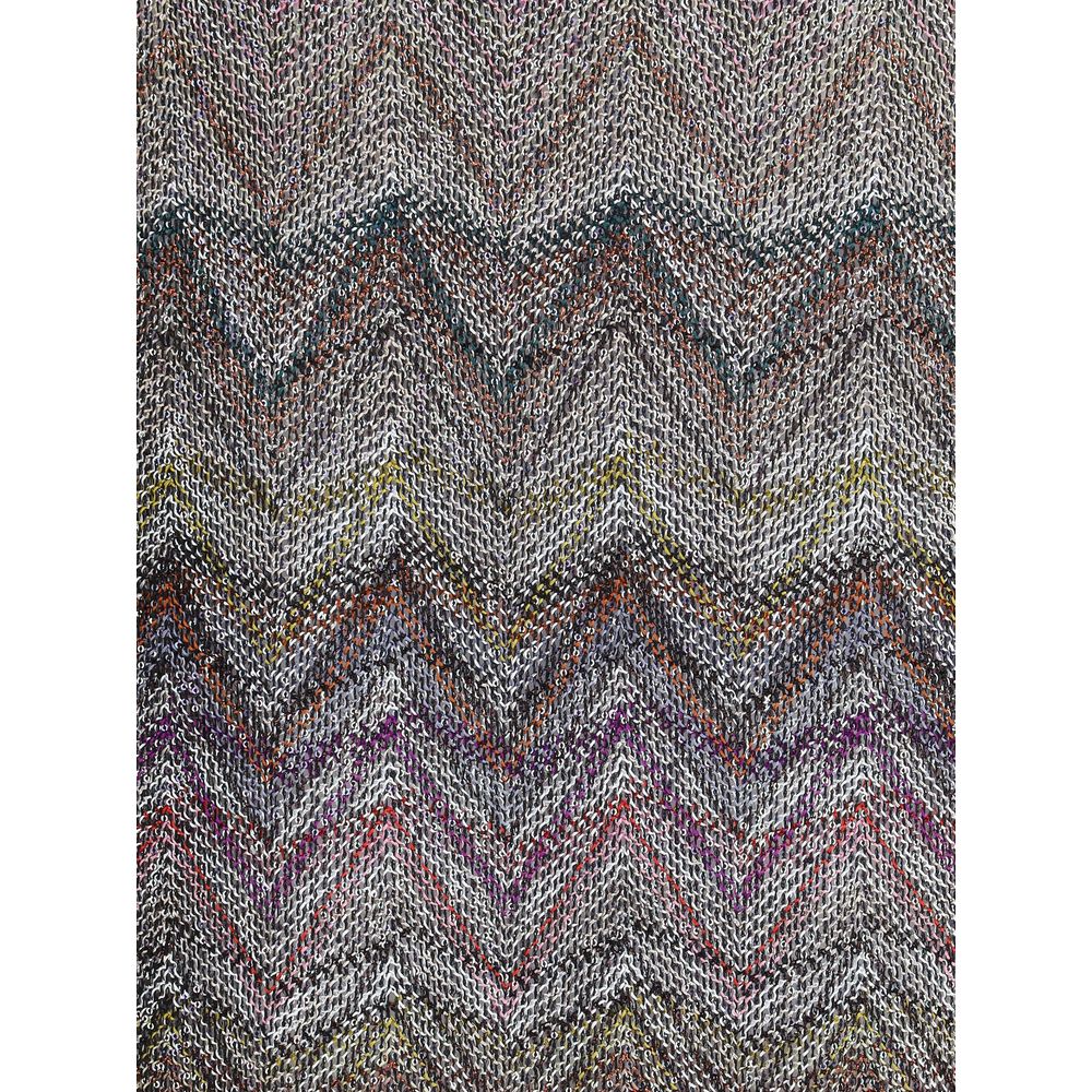 Zig zag T-ShirtMissoni’s sequined zig zag T-Shirt is a bright and refined garment made with Caperdoni’s exclusive loom work. The Maison’s classic zig zag pattern is enriched with lamé filaments and sequins, creating a bright and sophisticated effect. Made