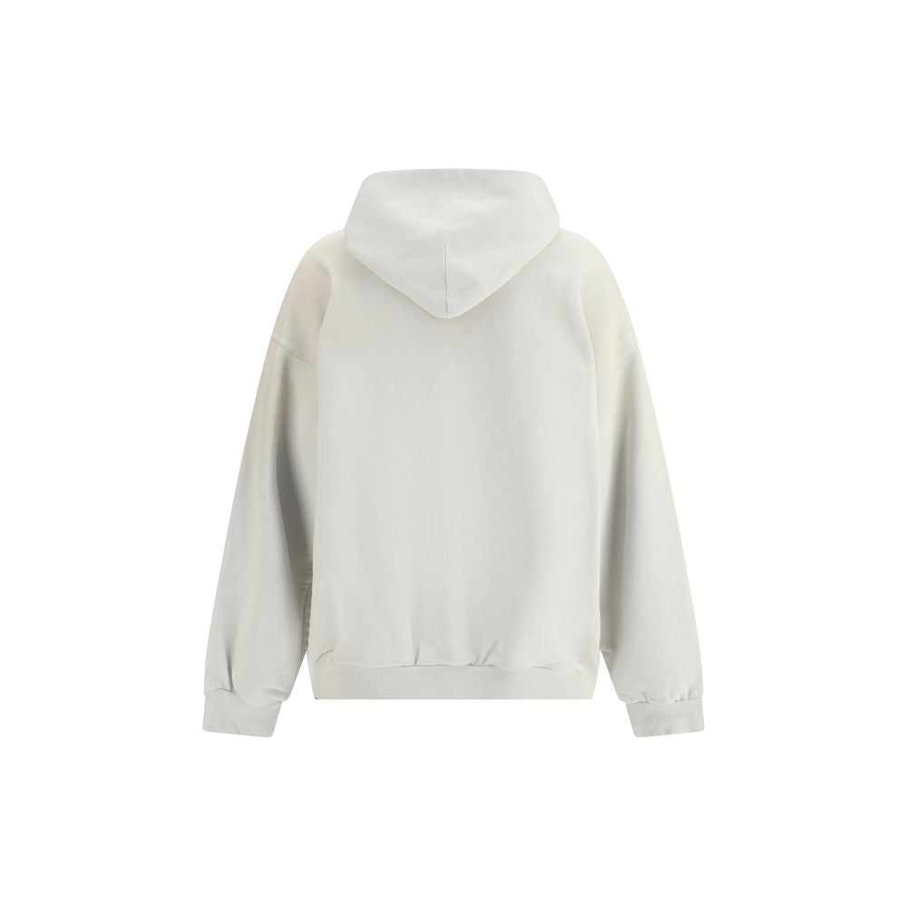 White Cotton SweatshirtBalenciaga’s City of Angels Hoodie combines comfort and urban identity in an essential yet striking design. Made of dry fleece, it features sloping shoulders, front pouch pocket and gathered trim on cuffs and waist. The drawstring-f