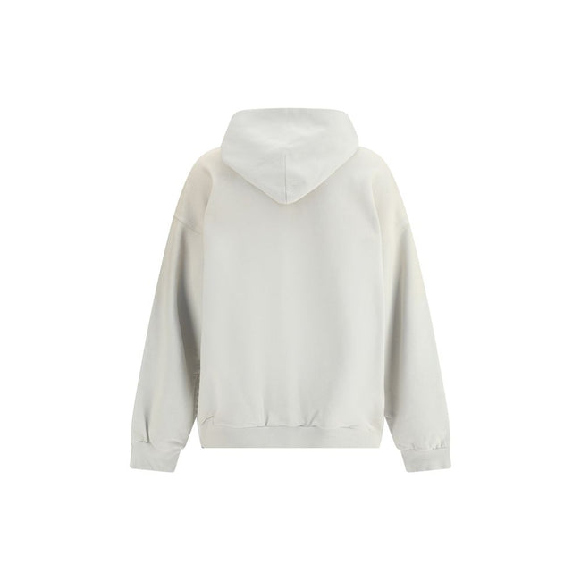 White Cotton SweatshirtBalenciaga’s City of Angels Hoodie combines comfort and urban identity in an essential yet striking design. Made of dry fleece, it features sloping shoulders, front pouch pocket and gathered trim on cuffs and waist. The drawstring-f