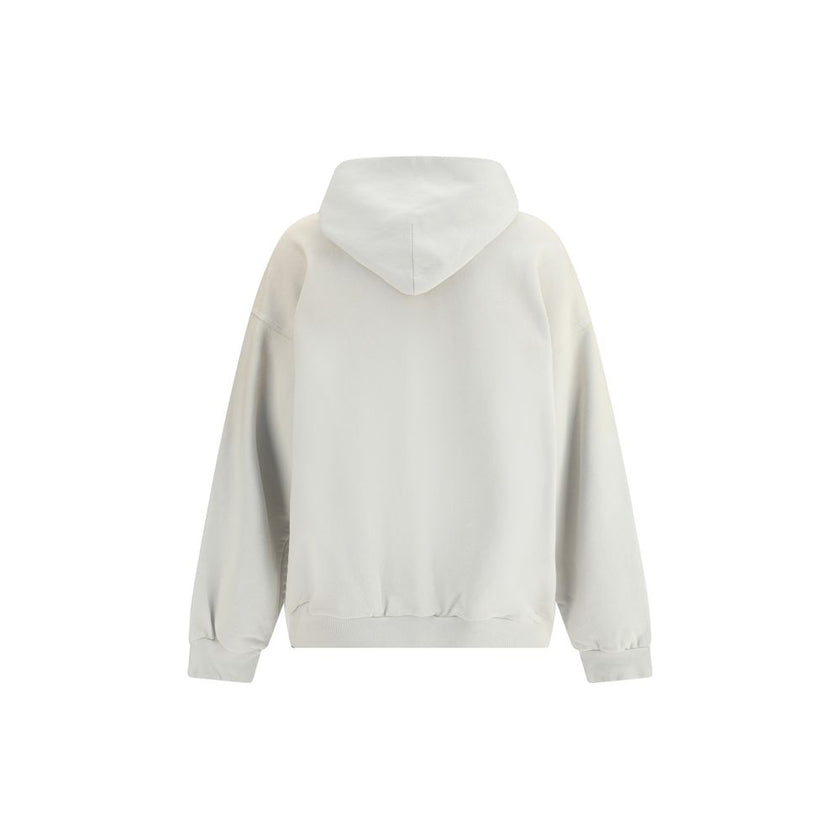 White Cotton SweatshirtBalenciaga’s City of Angels Hoodie combines comfort and urban identity in an essential yet striking design. Made of dry fleece, it features sloping shoulders, front pouch pocket and gathered trim on cuffs and waist. The drawstring-f