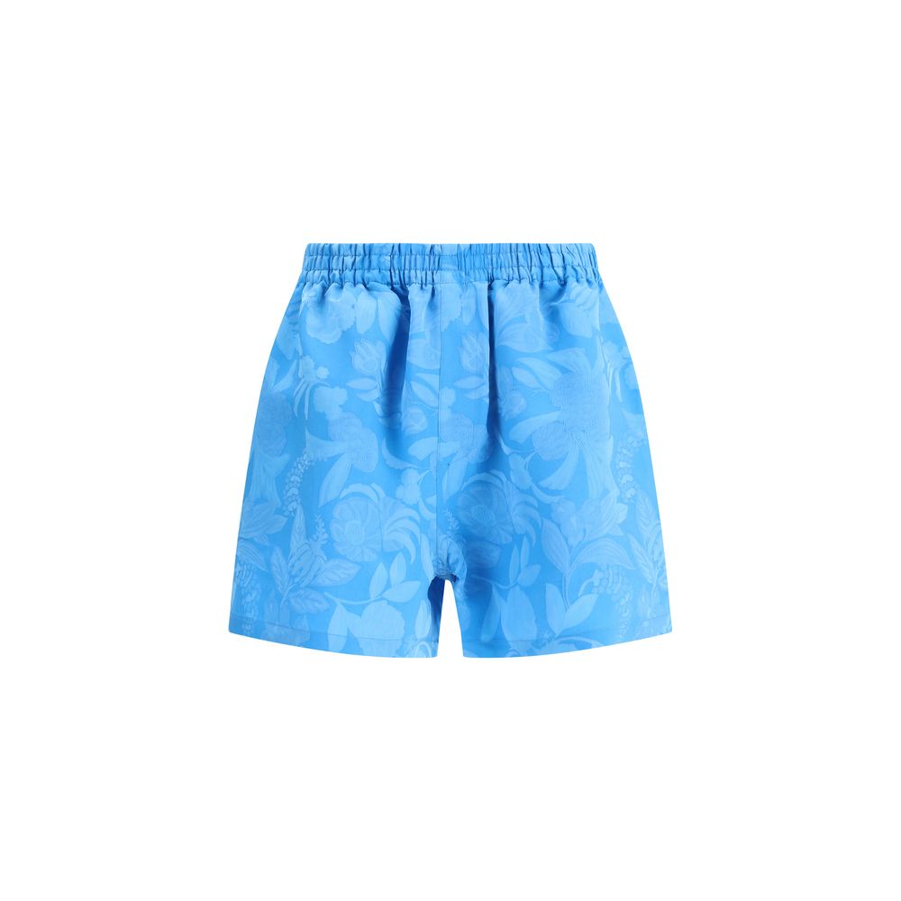 Blue Viscose Bermuda ShortsBalenciaga’s Floral patterned Shorts combine comfort and style in a soft, relaxed design. Featuring an elasticized waistband and two side welt pockets, they have a casual silhouette enhanced by a vibrant floral print, perfect fo