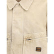 Beige Cotton Denim JacketBalenciaga’s Workwear crop Jacket reinterprets workwear with a modern and sophisticated twist. Featuring a classic collar, zipper front closure and snaps, it has two zippered patch pockets and a mini logo patch on the front. The w