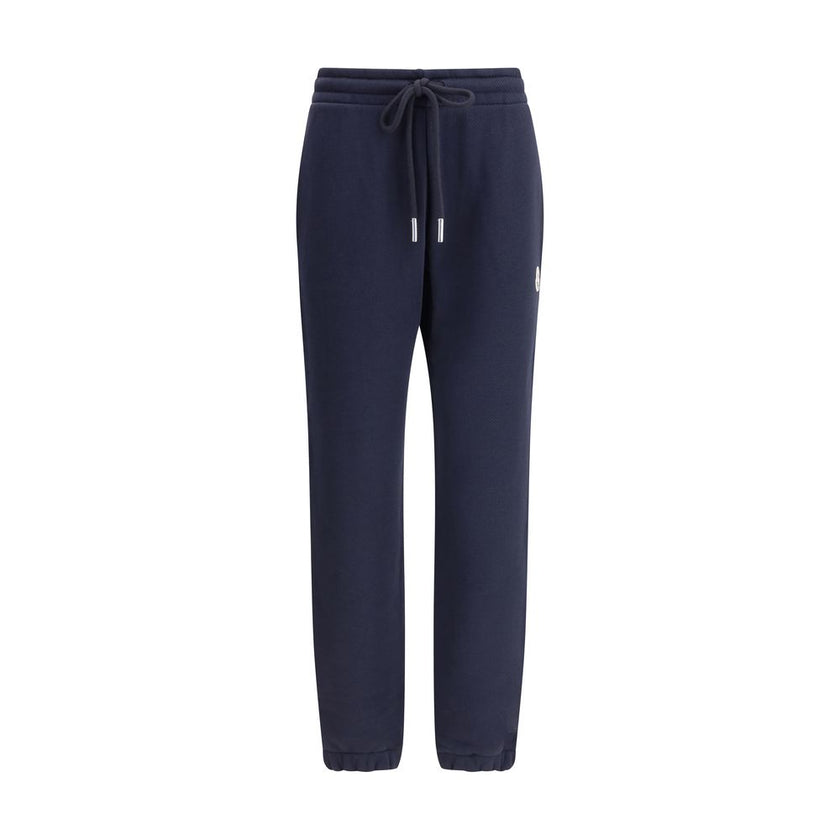 Blue Cotton Joggers (Workout Pants)Made from a soft cotton blend, Moncler’s Sweatpants combine comfort and sporty style. Featuring an elastic waistband with drawstring, inseam pockets and elastic cuffs, they are enhanced by a contrasting logo applique on