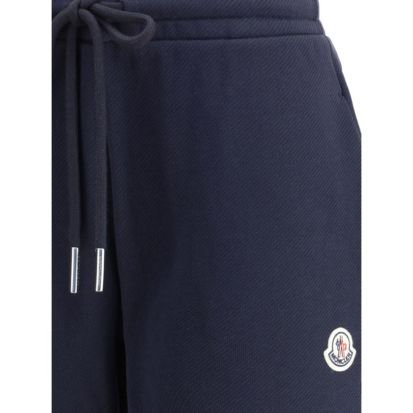 Blue Cotton Joggers (Workout Pants)Made from a soft cotton blend, Moncler’s Sweatpants combine comfort and sporty style. Featuring an elastic waistband with drawstring, inseam pockets and elastic cuffs, they are enhanced by a contrasting logo applique on