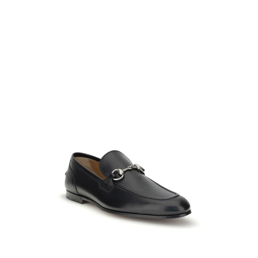 Black Calf Leather Bos Taurus Slip-On LoafersGucci’s smooth leather Jordan Loafers are a timeless classic, embellished with the iconic metallic Morsetto detail on the instep. Featuring a round toe and an elegant silhouette, they feature the logo embossed