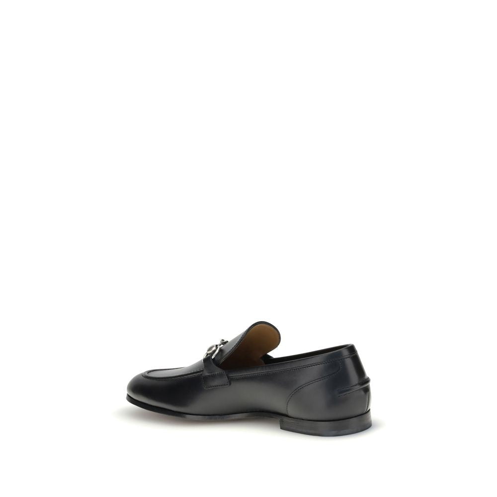 Black Calf Leather Bos Taurus Slip-On LoafersGucci’s smooth leather Jordan Loafers are a timeless classic, embellished with the iconic metallic Morsetto detail on the instep. Featuring a round toe and an elegant silhouette, they feature the logo embossed