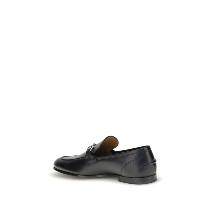 Black Calf Leather Bos Taurus Slip-On LoafersGucci’s smooth leather Jordan Loafers are a timeless classic, embellished with the iconic metallic Morsetto detail on the instep. Featuring a round toe and an elegant silhouette, they feature the logo embossed