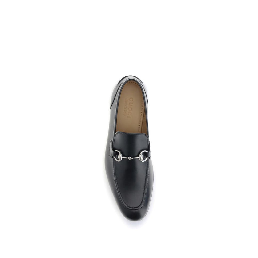 Black Calf Leather Bos Taurus Slip-On LoafersGucci’s smooth leather Jordan Loafers are a timeless classic, embellished with the iconic metallic Morsetto detail on the instep. Featuring a round toe and an elegant silhouette, they feature the logo embossed