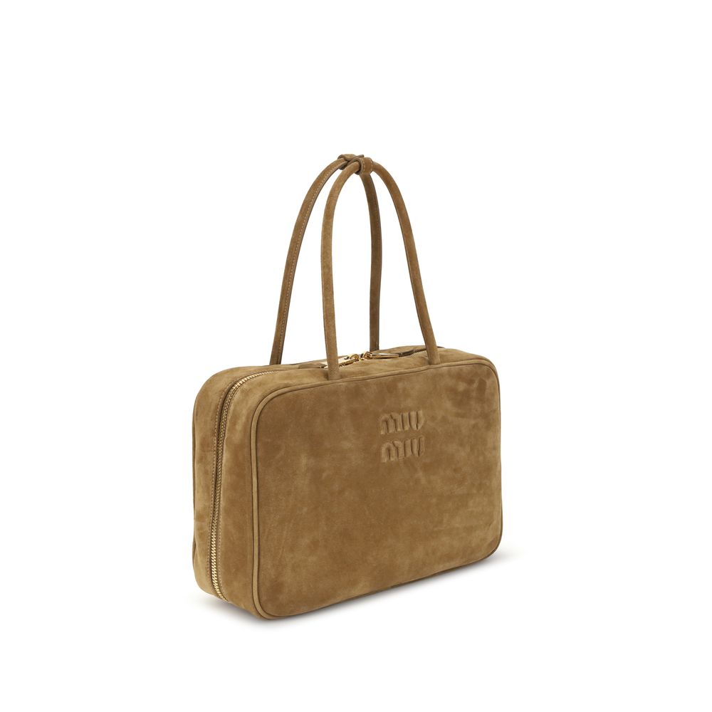 Beige Calf Leather Bos Taurus HandbagLeather Hand Bag by Miu Miu, suede design, double rigid and tubular top handle, top closure by double-slider zipper, iconic brand monogram pressure-stamped on front, maxi single compartment inside, removable and adjust