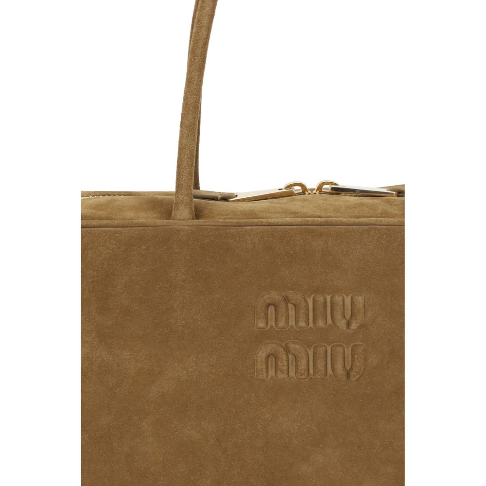 Beige Calf Leather Bos Taurus HandbagLeather Hand Bag by Miu Miu, suede design, double rigid and tubular top handle, top closure by double-slider zipper, iconic brand monogram pressure-stamped on front, maxi single compartment inside, removable and adjust