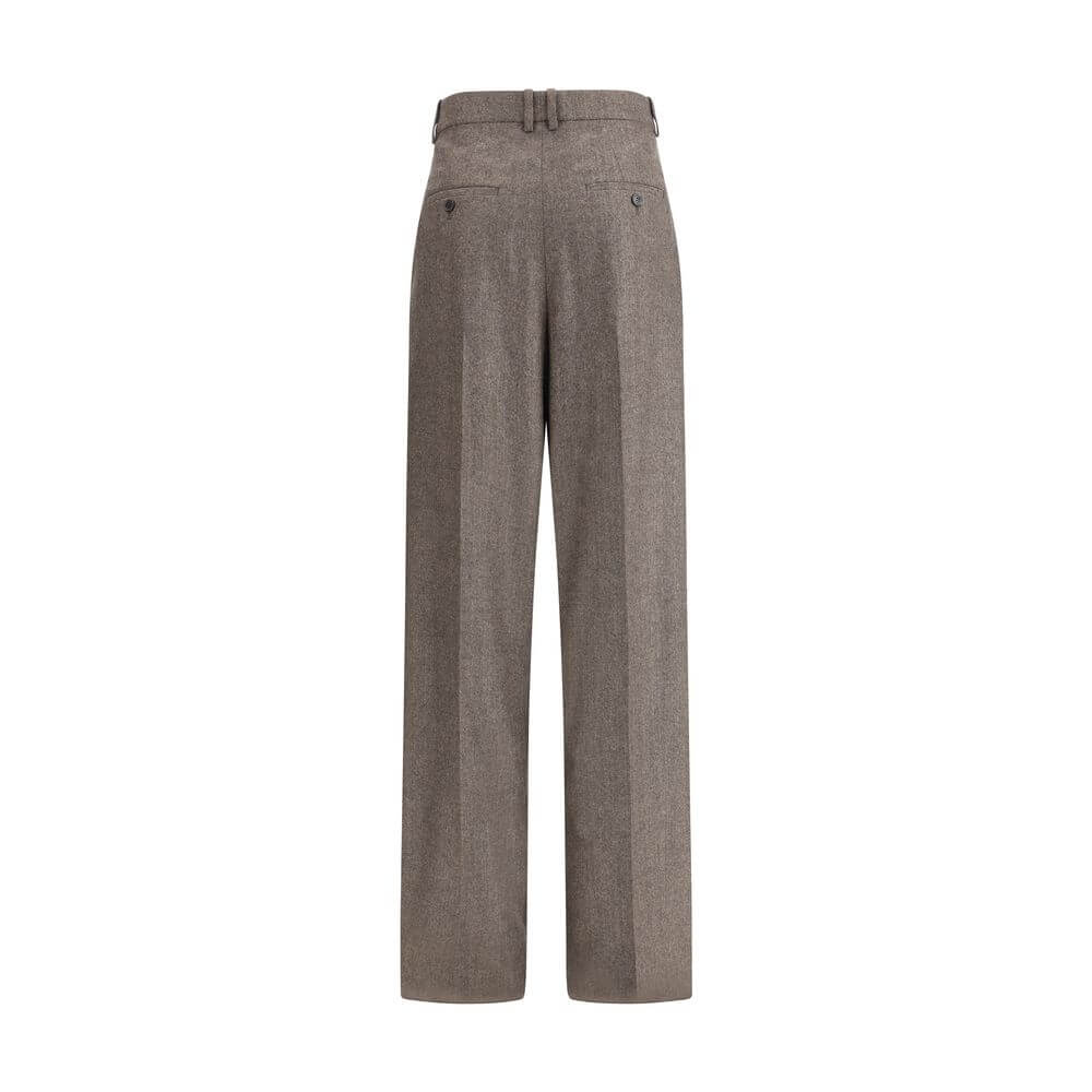 Wool Herringbone pattern wide leg PantsSaint Laurent’s wool Herringbone pattern wide leg Pants are an example of impeccable tailoring and timeless style. Featuring a medium waist and wide leg, they feature double pleats and a center crease that define an