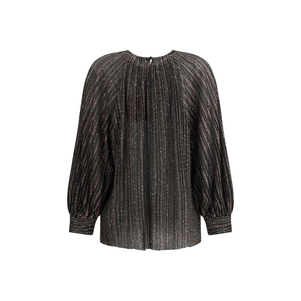 Striped sequined BlouseMissoni’s Striped sequined Blouse is a feminine and sophisticated piece, featuring a simple crew neck and balloon sleeves that give it volume and movement. The raw-cut hem adds a modern detail, while sequins embellish the striped pa