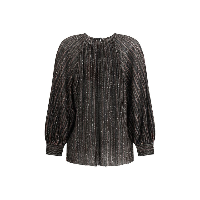 Striped sequined BlouseMissoni’s Striped sequined Blouse is a feminine and sophisticated piece, featuring a simple crew neck and balloon sleeves that give it volume and movement. The raw-cut hem adds a modern detail, while sequins embellish the striped pa