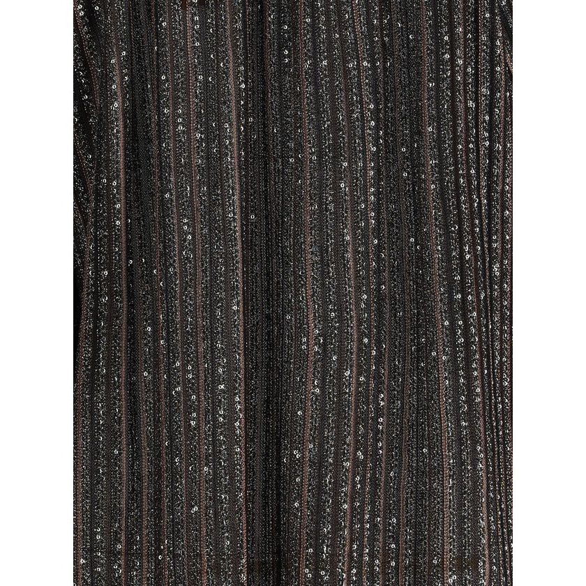 Striped sequined BlouseMissoni’s Striped sequined Blouse is a feminine and sophisticated piece, featuring a simple crew neck and balloon sleeves that give it volume and movement. The raw-cut hem adds a modern detail, while sequins embellish the striped pa