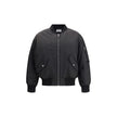 Black Polyamide BomberSaint Laurent’s oversized bomber Jacket is made of water-repellent recycled polyamide, perfect for an urban and functional look. Featuring a front zipper closure, it has two slanted flap and snap pockets, a zippered sleeve pocket and