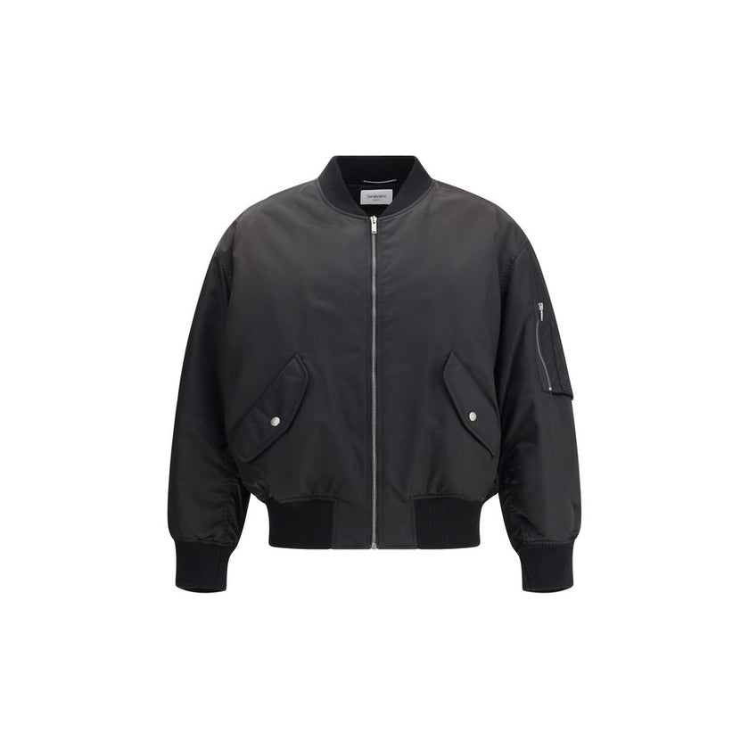 Black Polyamide BomberSaint Laurent’s oversized bomber Jacket is made of water-repellent recycled polyamide, perfect for an urban and functional look. Featuring a front zipper closure, it has two slanted flap and snap pockets, a zippered sleeve pocket and