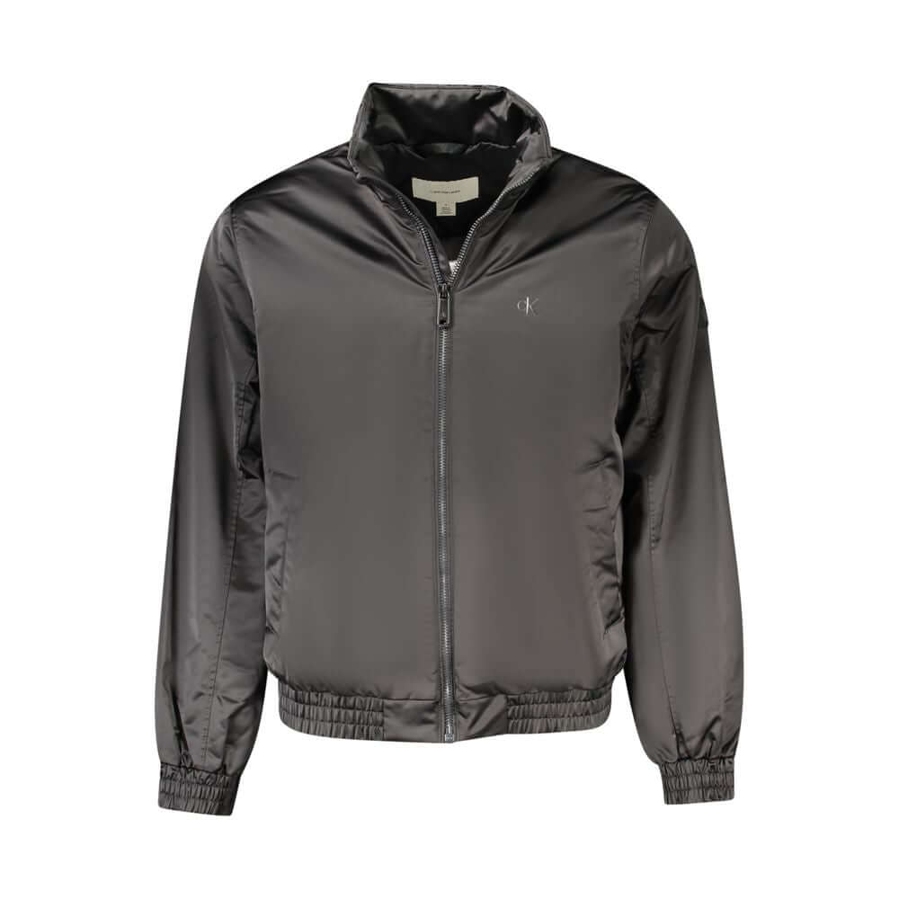 Black Polyester Men JacketStep into the epitome of both sustainability and style with this stunning Calvin Klein jacket. Crafted from 100% recycled polyester, it is as eco-conscious as it is eye-catching. With functionality at its core, the jacket offers