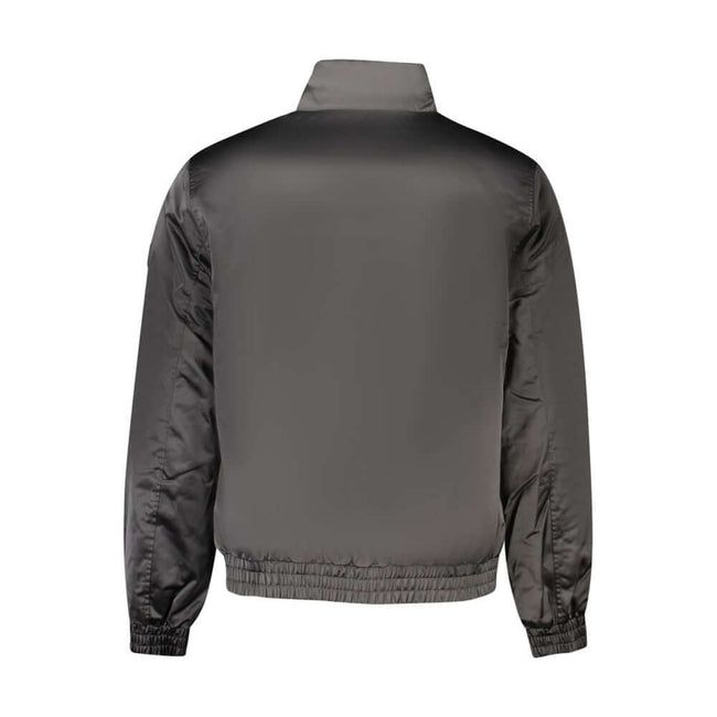 Black Polyester Men JacketStep into the epitome of both sustainability and style with this stunning Calvin Klein jacket. Crafted from 100% recycled polyester, it is as eco-conscious as it is eye-catching. With functionality at its core, the jacket offers