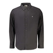 Black Cotton Men ShirtInfuse sophistication into your wardrobe with this Calvin Klein classic fit shirt. Its sharp button-down collar and chic 2-button cuffs exemplify timeless style, all while the embroidered logo adds a touch of the brand’s iconic allur