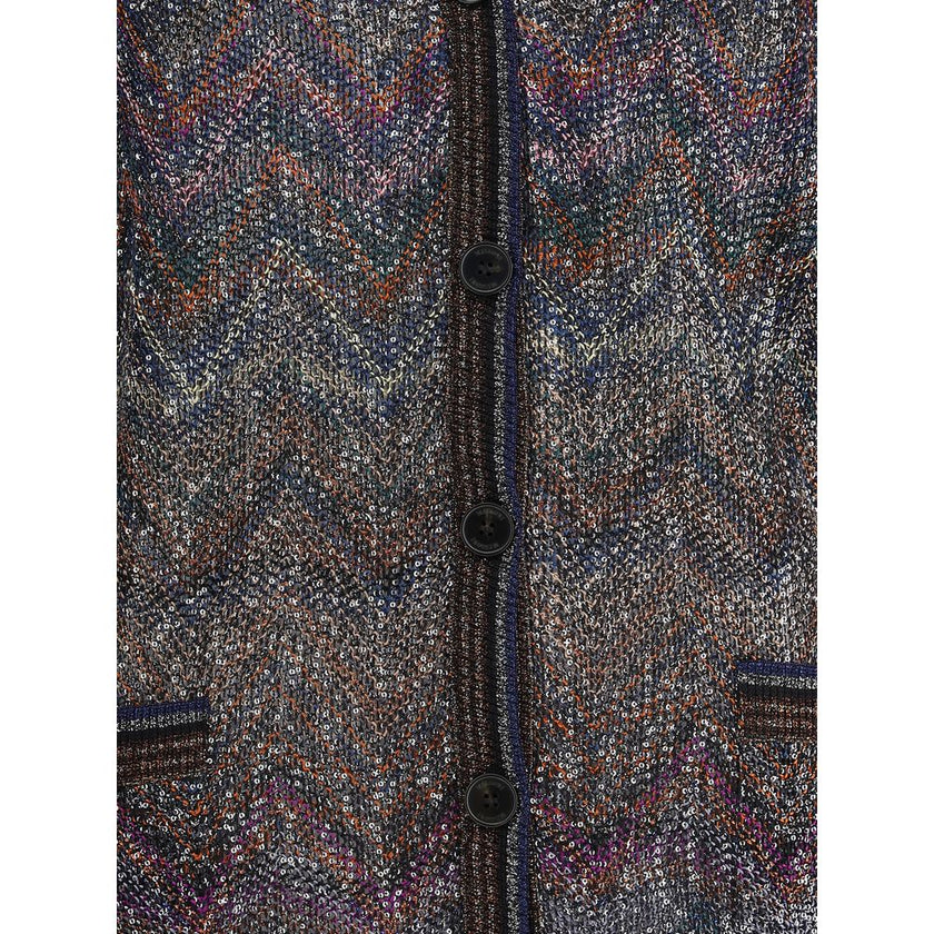 Caperdoni Buttoned CardiganMissoni’s zig zag-patterned oversized cardigan is a wrap-around, coveted piece made with Caperdoni’s exclusive loom work. Featuring a V-neckline, button closure and practical front pockets, it is embellished with the Maison’s ic