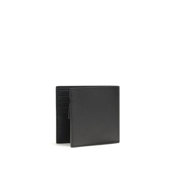 Black Calf Leather Bos Taurus WalletSaint Laurent’s black leather wallet is a stylish and functional accessory with a bill fold design. Made of high-quality smooth leather, it features interior card slots, a snap-button coin compartment and several bill c