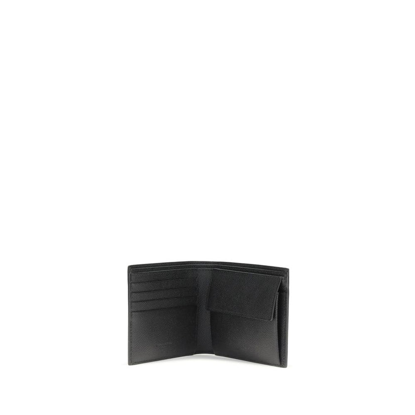 Black Calf Leather Bos Taurus WalletSaint Laurent’s black leather wallet is a stylish and functional accessory with a bill fold design. Made of high-quality smooth leather, it features interior card slots, a snap-button coin compartment and several bill c