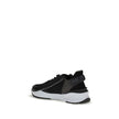 Gray Calf Leather Bos Taurus Athletic SneakersFendi’s Flow Sneakers combine style and practicality in a distinctive modern design. Slip-ons with elastic laces and a side zipper, they are made of black FF jacquard nylon and embellished with black leather d