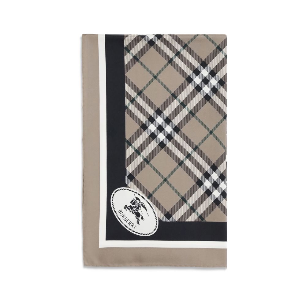 Beige Silk ScarfBurberry’s silk Scarf celebrates the house’s heritage with timeless elegance. Featuring the iconic all-over Archive Check pattern, it is embellished with the Equestrian Knight logo printed on one of the corners. Made of fine silk, it is th