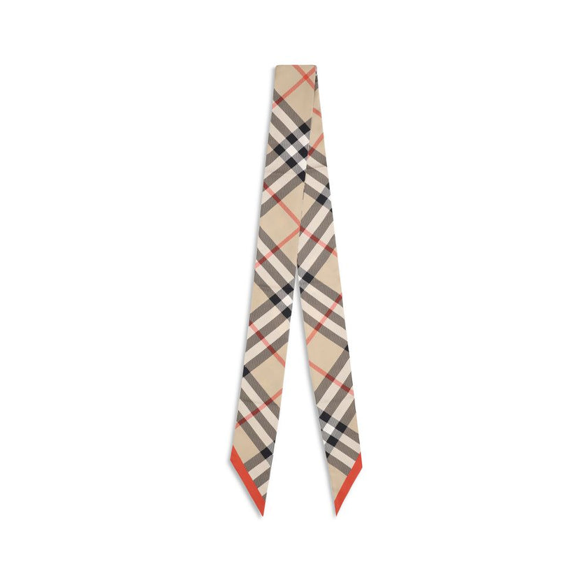 Beige Silk ScarfBurberry’s silk Check Scarf is a timeless classic, made of pure silk and decorated with the unmistakable Burberry Check print. Elegant and versatile, it adds an iconic touch to any look, confirming the distinctive style of the British fash