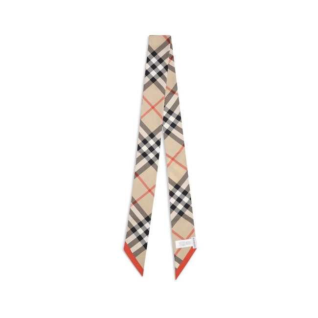 Beige Silk ScarfBurberry’s silk Check Scarf is a timeless classic, made of pure silk and decorated with the unmistakable Burberry Check print. Elegant and versatile, it adds an iconic touch to any look, confirming the distinctive style of the British fash