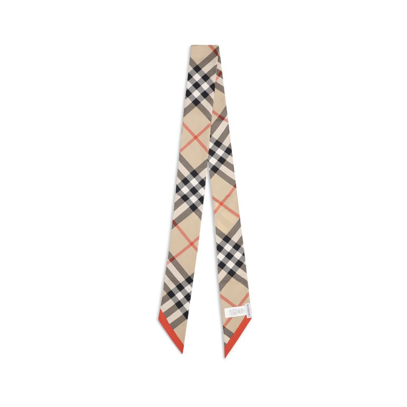 Beige Silk ScarfBurberry’s silk Check Scarf is a timeless classic, made of pure silk and decorated with the unmistakable Burberry Check print. Elegant and versatile, it adds an iconic touch to any look, confirming the distinctive style of the British fash
